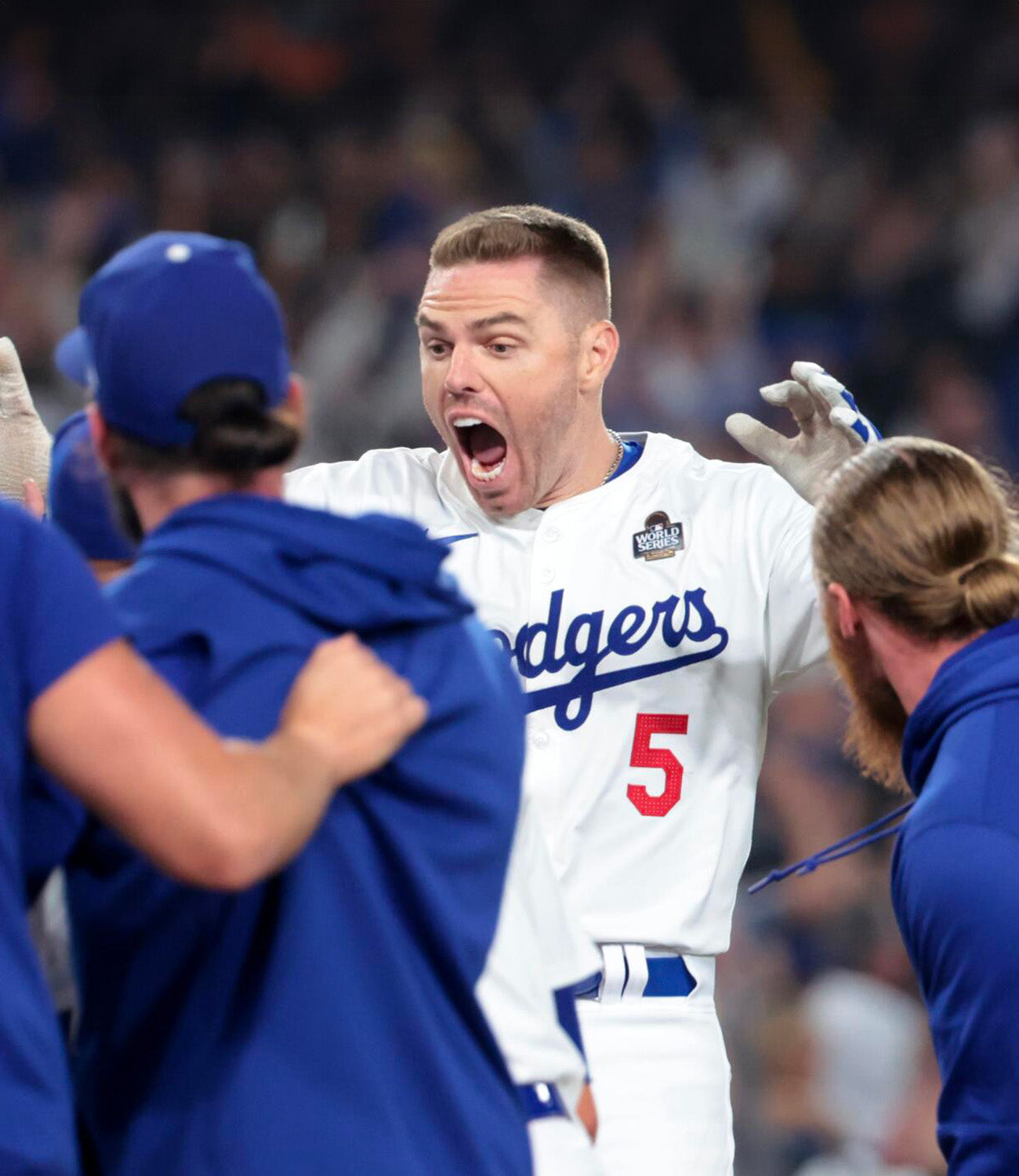 Freddie Freeman celebrates his historic walk-off grand slam with teammates