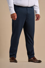 Front view of the navy SmartFit pant, styled with a white shirt and brown loafers.